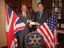 President David Hearnshaw presents a cheque to John Clayton